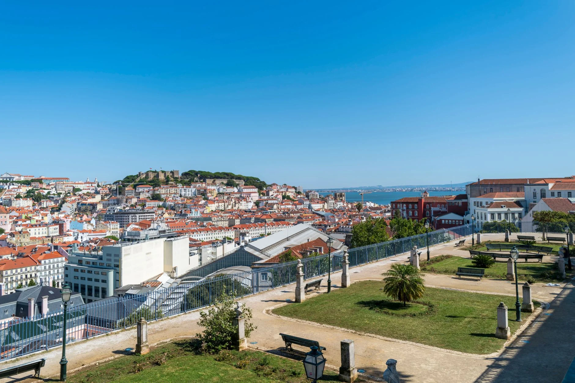 View of the Lisbon skyline and Sao Jorge Castle from a garden viewpoint