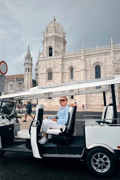 White Tukxi tuk tuk parked in front of Jerónimos Monastery in Belém, Lisbon